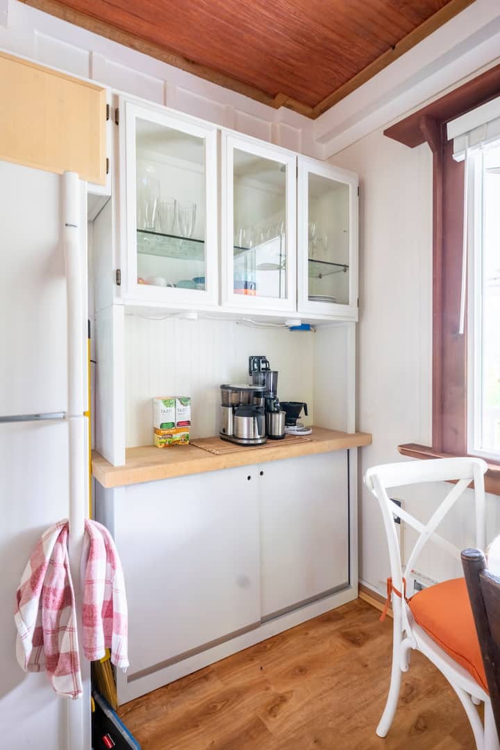 Coffee bar with glass-front cabinets