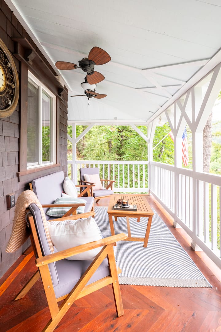 Wraparound porch with ceiling fans and seating